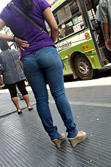 Big butt jeans girl on bus stop